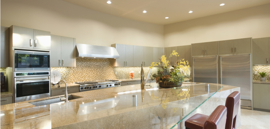 a kitchen in home with recessed lighting roof