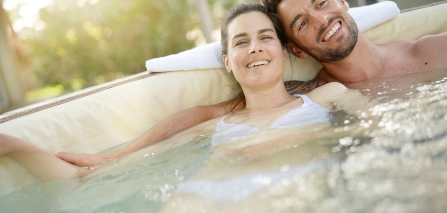 couple relaxing in a hot tub