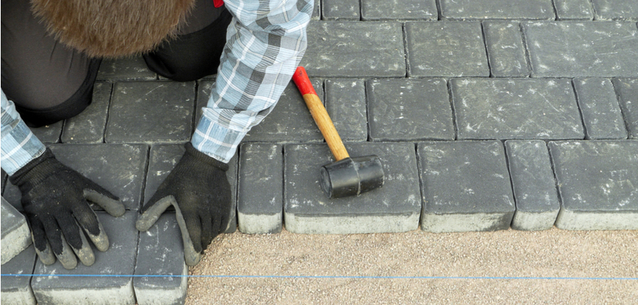 paver laying driveway pavement 